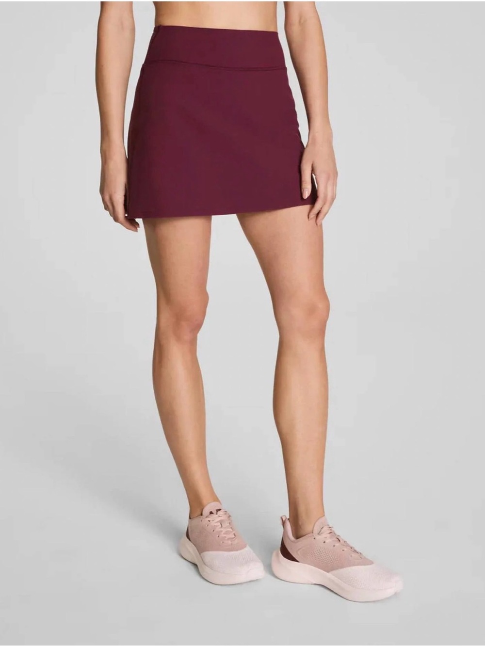 SPANX Athletic Skort in Burgundy / Plum Berry; built in shorts with pockets